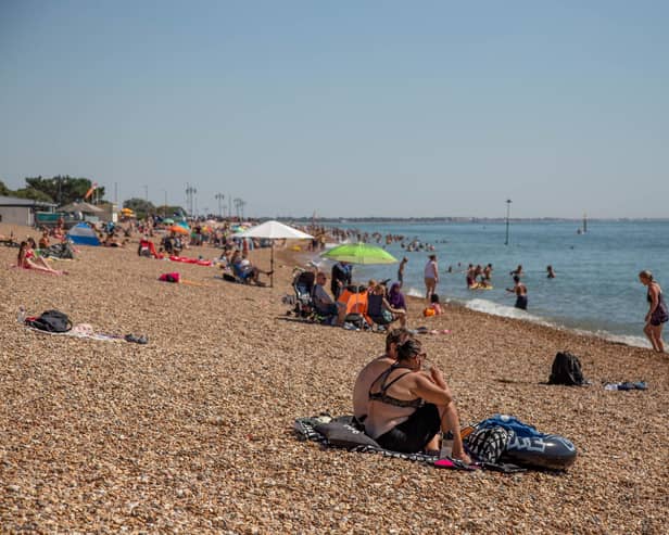 People enjoying some fine weather on Southsea Beach.