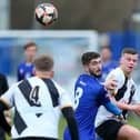 Dillon North  (blue) saw his penalty saved as Baffins were beaten by Aldershot in the quarter-finals of the Hampshire Senior Cup