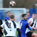 Dillon North  (blue) saw his penalty saved as Baffins were beaten by Aldershot in the quarter-finals of the Hampshire Senior Cup