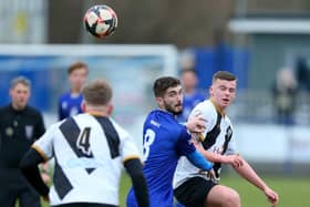 Dillon North  (blue) saw his penalty saved as Baffins were beaten by Aldershot in the quarter-finals of the Hampshire Senior Cup