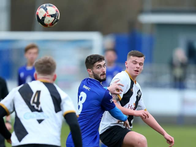 Dillon North  (blue) saw his penalty saved as Baffins were beaten by Aldershot in the quarter-finals of the Hampshire Senior Cup