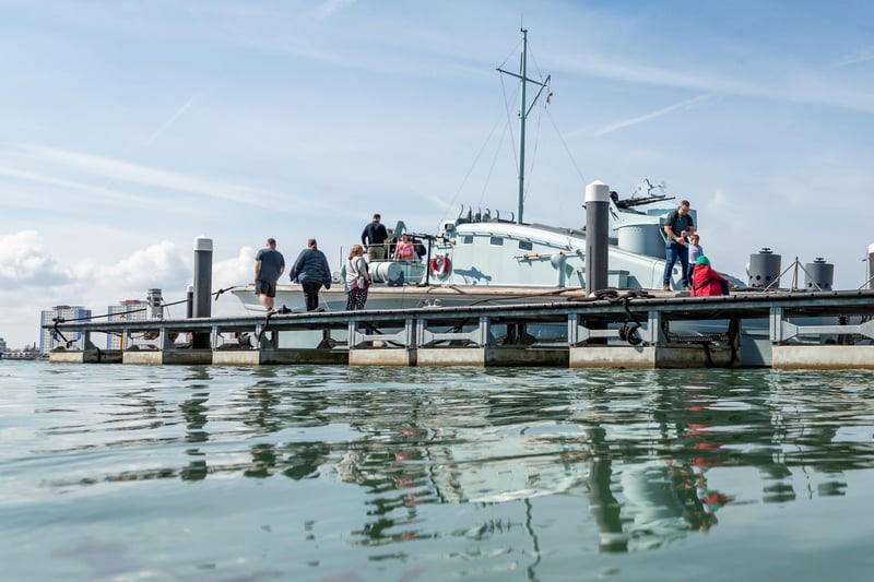 Visitors exploring the restored craft in Portsmouth Harbour. Picture: Mike Cooter (08042023)