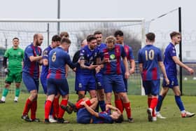 US Portsmouth's Owen Scammell appears in pain on the ground after Ethan Gee's red card challenge Picture: Paul Collins