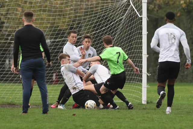 Seagull get bodies behind the ball as they defend against Freehouse in Division 2 of the Portsmouth Sunday League. Picture: Kevin Shipp.
