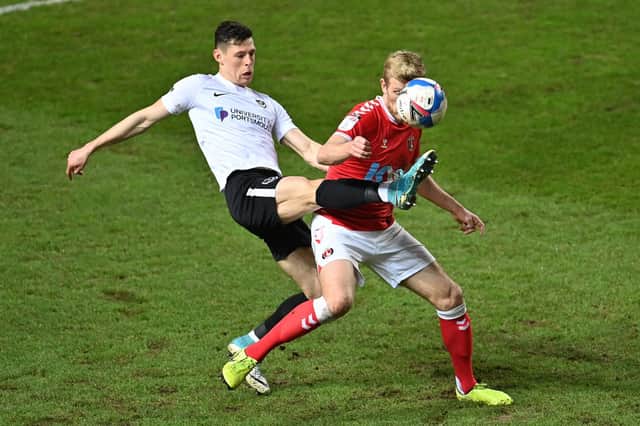 Recalled James Bolton challenges Jayden Stockley in the 3-1 victory at Charlton on Tuesday night. Picture: Justin Setterfield/Getty Images