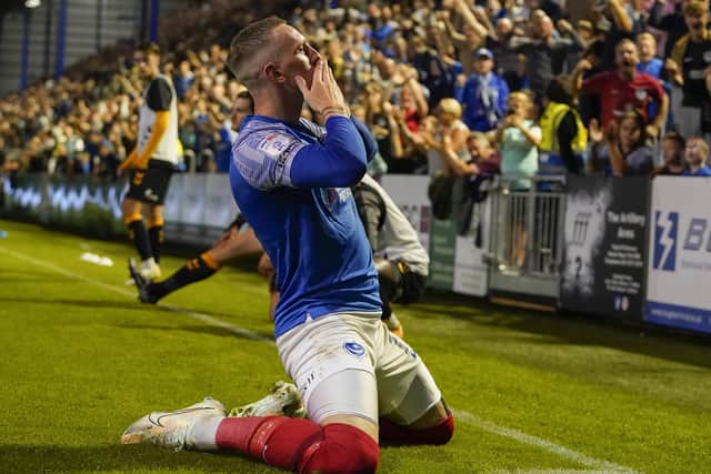 Ronan Curtis blows kisses to the Fratton faithful following his goal against Cambridge United on Tuesday night