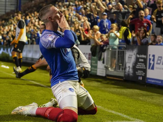 Ronan Curtis blows kisses to the Fratton faithful following his goal against Cambridge United on Tuesday night