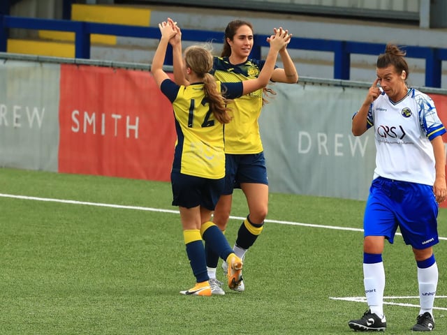 Moneys' Ella Wright celebrates her goal with Kau'inohea Taylor. Picture by Dave Haines