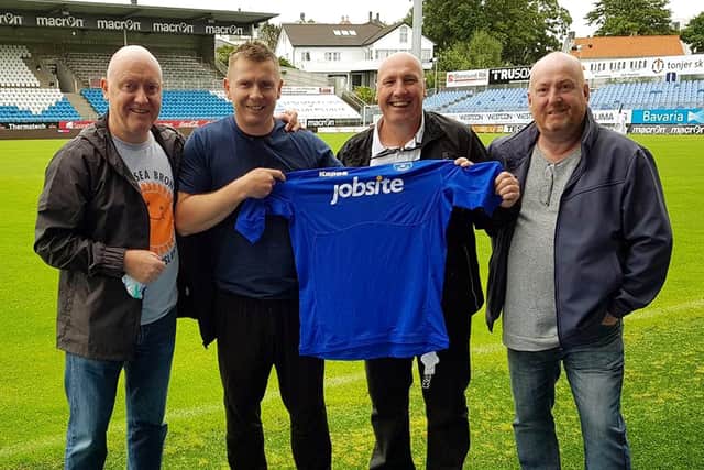 Jostein Grindhaug was presented with a Blues shirt in 2018 by Pompey supporters Jake Payne, Steve O’Shea and Chris Paige