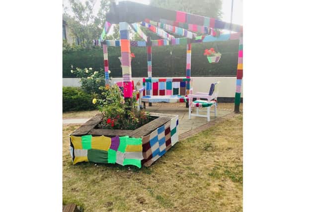 Residents at Alexandra Rose care home in Farlington have been creating 'yarn bombs' to cover trees in the garden during lockdown. Pictured: Efforts from previous years