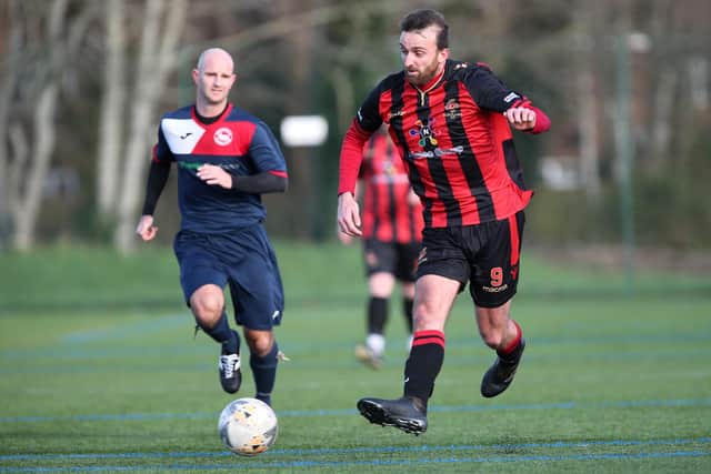 Jamie Wrapson (Fleetlands) watched by John Cripps of Paulsgrove during a 2019/20 Hampshire Premier League game. Picture: Chris Moorhouse