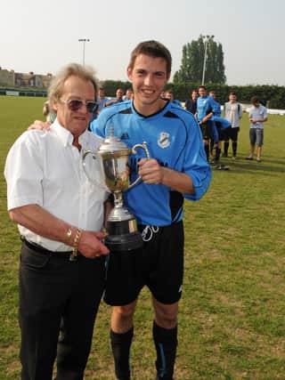 Flashback - Barry Campbell presents the Portsmouth Dockyard League's John Sugden Cup to Co-Op Dragons' Robert Crook after his side's victory over Star Electrical at Moneyfields FC in 2011. Picture: Malcolm Wells