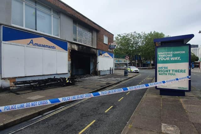A police cordon remains in place around the scene of the fire in Commercial Road. Picture: Habibur Rahman