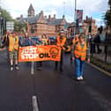Just Stop Oil protestors carrying out a slow march in Southsea to spread their message about fossil fuels destroying the planet. Traffic was slowed down to a crawl. Picture: Just Stop Oil.