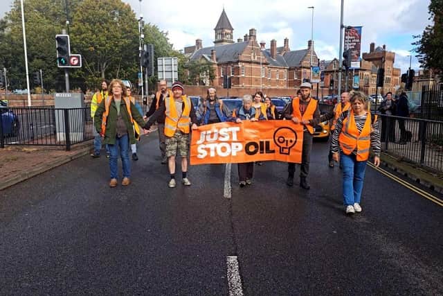 Just Stop Oil protestors carrying out a slow march in Southsea to spread their message about fossil fuels destroying the planet. Traffic was slowed down to a crawl. Picture: Just Stop Oil.