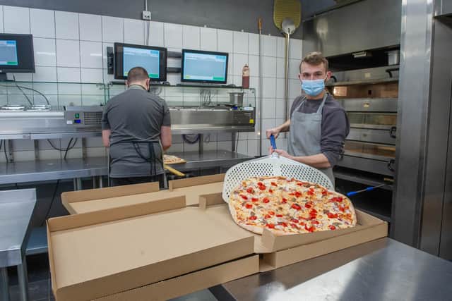 Giorgio's Pizza, Waterlooville, is set to expand from its takeaway and restaurant in London Road, into another takeaway outlet in London Road, Hilsea. Pictured: Alan Bevan making a pizza at Giorgio's Pizza, Waterlooville on December 8, 2021. Pictured: Habibur Rahman.
