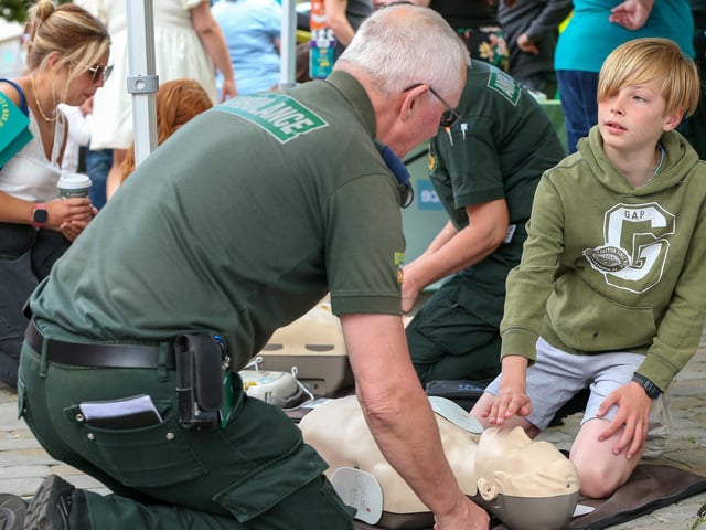 Harrison Key, 10, brushes up on his CPR at Fareham 999 Day.Picture: Chris  Moorhouse (220624-11)