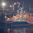 Migrants are brought ashore at Fort Blockhouse in Gosport on October 4 