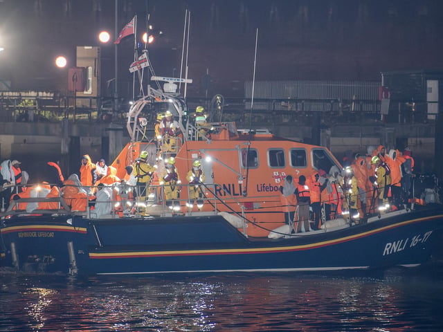 Over 100 illegal migrants aboard two RNLI lifeboats entered Portsmouth Harbour on Sunday evening just after 10pm, heading for Fort Blockhouse in Gosport, Hampshire where teams from the Home Office were there to welcome the migrants. They were then heading to board one of a number of buses waiting for them. Pictured passing Fort Blockhouse.   Credit: pictureexclusive.com