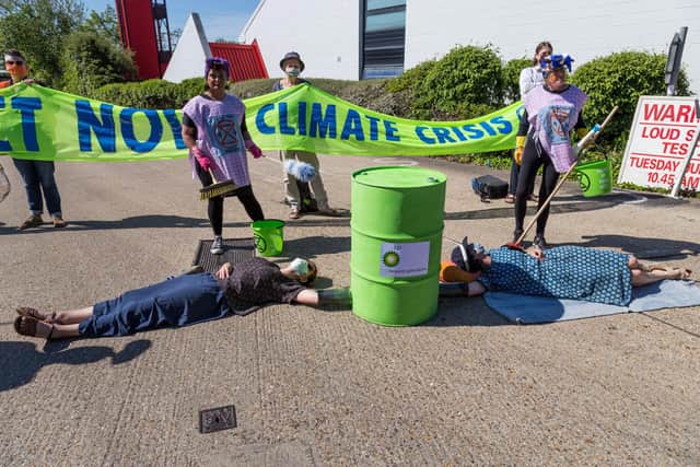 Handout photo issued by Extinction Rebellion of activists locking down BP's Southampton oil terminal highlighting Government and fossil fuel industry "greenwash" policies. Issue date: Tuesday June 1, 2021. Photo: William Templeton/PA Wire