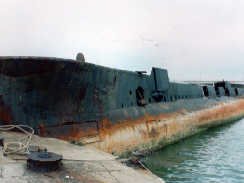 The former H.M.Submarine P556 abandoned in Harry Pounds yard.