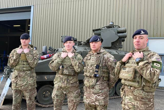 Soldiers from 12 Regiment, Royal Artillery, standing in front of the armoured Stomer vehicle, which can fire a number of high-velocity missiles into the air to destroyer jets and helicopters. Pictured left to right: Gunner Connor Cowan, Gunner Ben Ratcliffe, Lance Bombardier Ben Longley and Bombardier Robin Hearn.