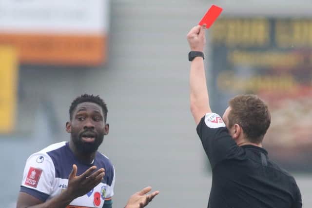 Godfrey Poku reacts after being shown a red card in Hawks' FA Cup win over Cray Valley. Picture: Kieron Loulodis