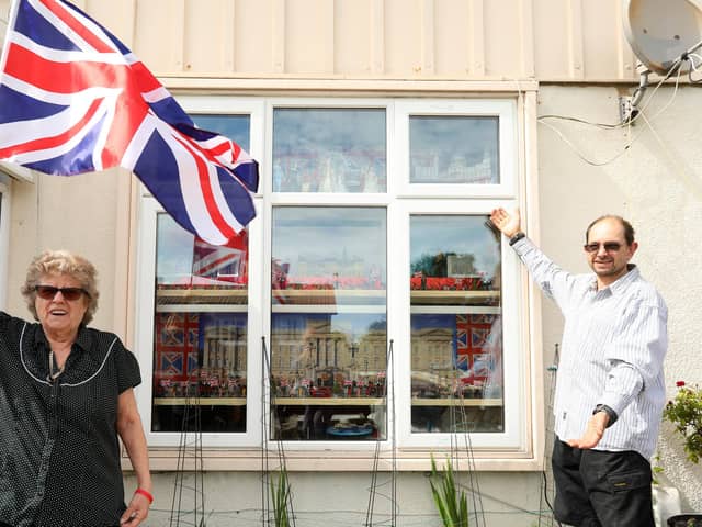 Vera Harris and her son David Harris have made a window display at their home in Paulsgrove to celebrate the Queen's Platinum Jubilee. Picture: Chris Moorhouse (jpns 230522-28)