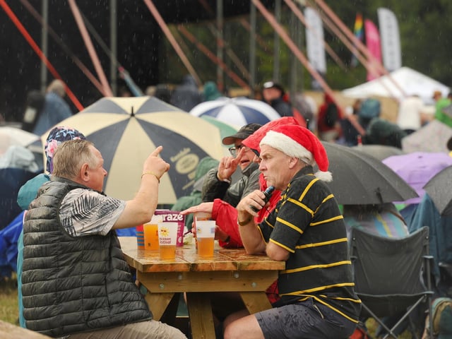 Umbrellas and Santa hats made unexpected appearances at the Wickham Festival 2025.  Picture: Sarah Standing (310725-1260)