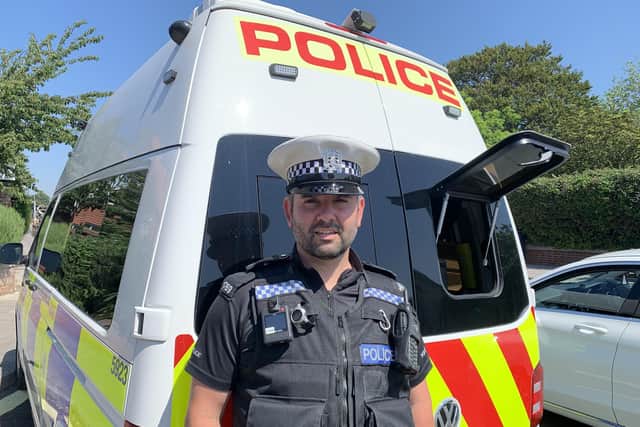 PC Dave Hazlett in Milton Road, Portsmouth, on July 20 next to a mobile camera van. Picture: Ben Fishwick