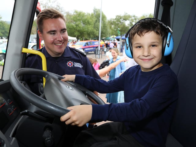 A firefighter shows Caleb Bush, 9, the cab of a fire engine. 999 Day at Port Solent
Picture: Chris Moorhouse (jpns 030922-09)