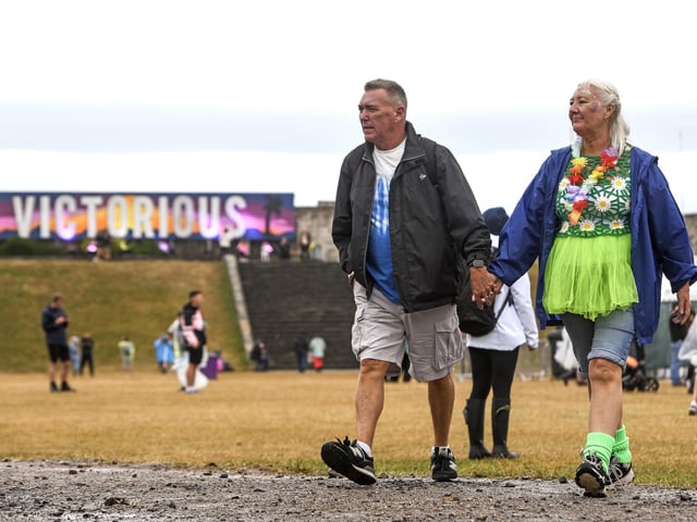 People brave the wet weather at Victorious Festival on Southsea Common in Portsmouth today during the three day event the bank holiday weekendPicture Credit: Solent News Agency