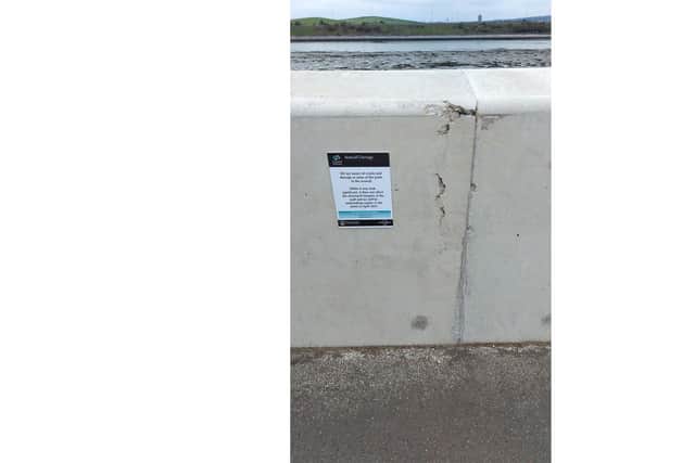 Damage to the sea defences at Tipner Lake