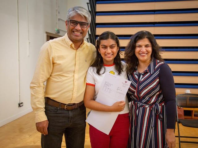 Pictured: Jim Khan with his daughter Ashlyn and wife Sadaf. Ashlyn got two As in Biology and Psychology, and a B in Chemistry. Picture: Habibur Rahman