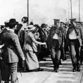 The walking wounded arrive in Goldsmith Avenue, Fratton, in October 1914. Bugler Clark of the Dorset Regiment (right) carries a German helmet as a trophy