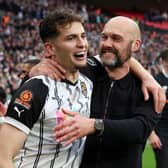 Ruben Rodrigues, left, celebrates with Notts County manager Luke Williams following the Magpies' National League play-off final win against Paul Cook's Chesterfield     Picture: Eddie Keogh/Getty Images