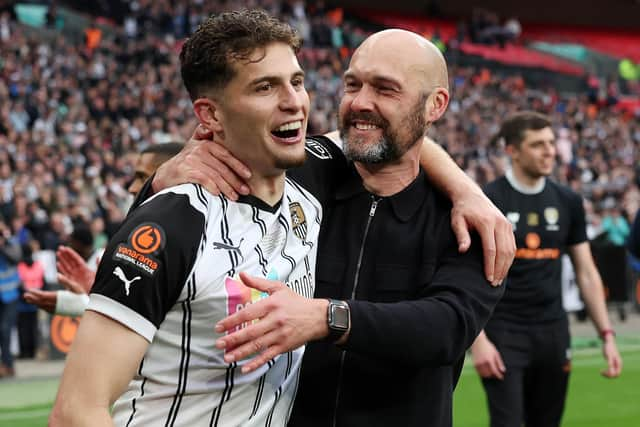 Ruben Rodrigues, left, celebrates with Notts County manager Luke Williams following the Magpies' National League play-off final win against Paul Cook's Chesterfield     Picture: Eddie Keogh/Getty Images