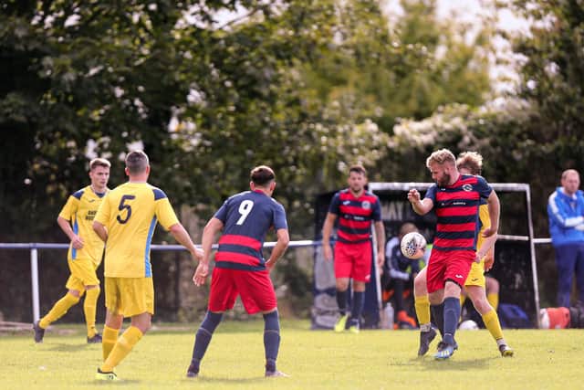 Tommy Doughty, right, in action for Paulsgrove against Liphook. Picture: Chris Moorhouse