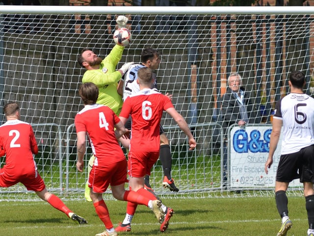 Horndean keeper Cameron Scott punches clear. Picture by Martyn White