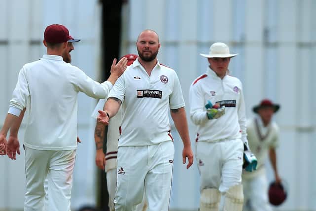 Portsmouth & Southsea's Jono Willey, second left, has just taken a Gosport wicket.
Picture: Chris Moorhouse