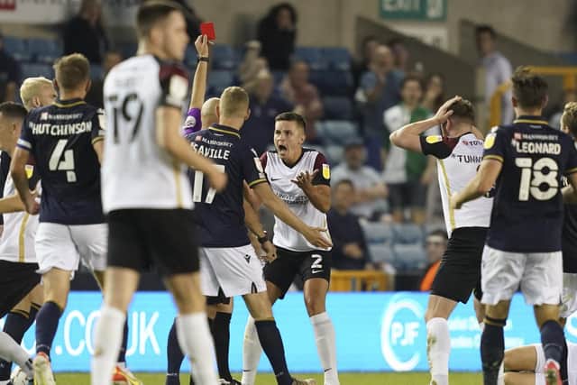 Callum Johnson is horrified to receive his marching orders at Millwall in August 2021. He never played for Pompey again. Picture: Jason Brown/ProSportsImages