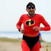 Martin Pegler completed his 100th Lee-on-the-Solent dressed in Disney film Incredibles Mr Muscle costume on what was the 300th staging of the seafront course event Picture: Chris Moorhouse (jpns 180622-09)