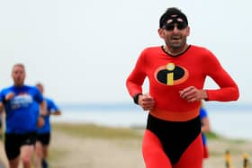 Martin Pegler completed his 100th Lee-on-the-Solent dressed in Disney film Incredibles Mr Muscle costume on what was the 300th staging of the seafront course event Picture: Chris Moorhouse (jpns 180622-09)