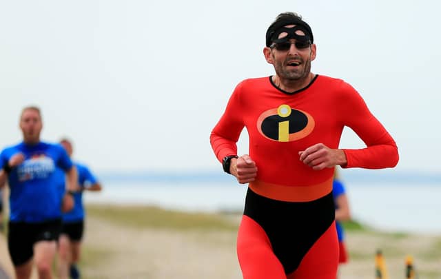 Martin Pegler completed his 100th Lee-on-the-Solent dressed in Disney film Incredibles Mr Muscle costume on what was the 300th staging of the seafront course event Picture: Chris Moorhouse (jpns 180622-09)