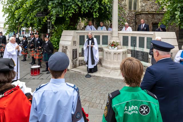 The wreath laying service outside St Faith's Church in Havant. Picture: Mike Cooter (090622)