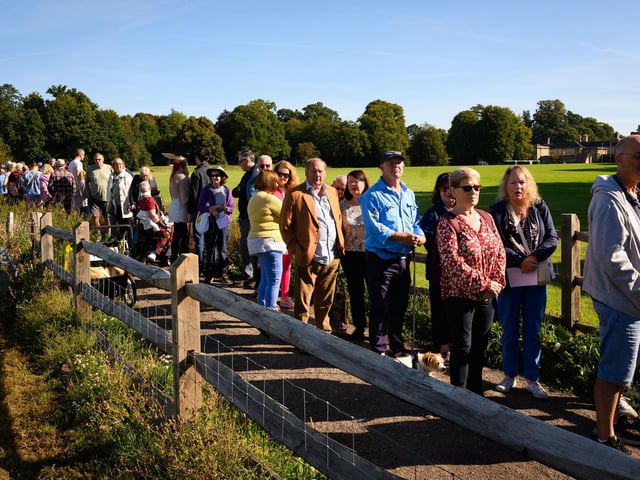 Pictured is: Visitors to the South Downs Food Festival wait to enter Picture: Keith Woodland (140921-1)