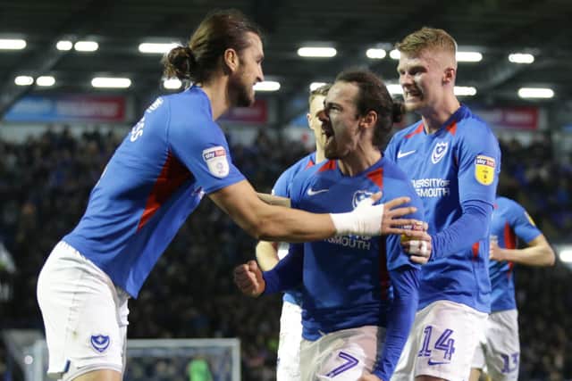 Ryan Williams, centre, celebrates his goal in Friday night's 3-0 win against Rochdale at Fratton Park.  Picture: Robin Jones