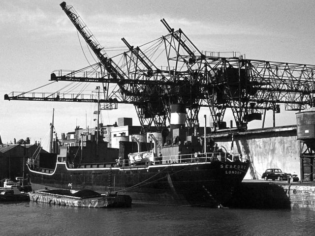Cranes and collier Seaford registered in London in the CamberThere can't be many people who can remember the cranes working in the Camber unloading coal from a collier. Picture: Graham Stevens.