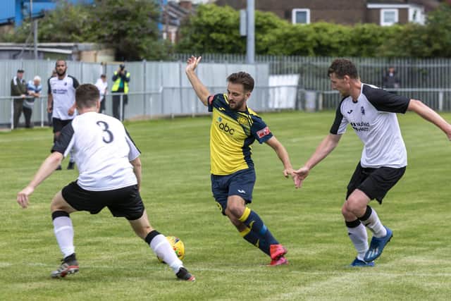 Dec Seiden (yellow) made his return from injury as a second haf sub at Brockenhurst. Picture: Mike Cooter