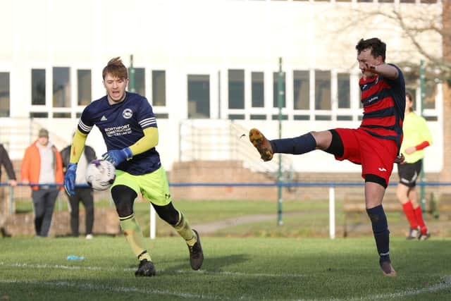 Paulsgrove striker Danny Lane scores the second of his three first-half goals against Bush Hill. Picture: Chris Moorhouse